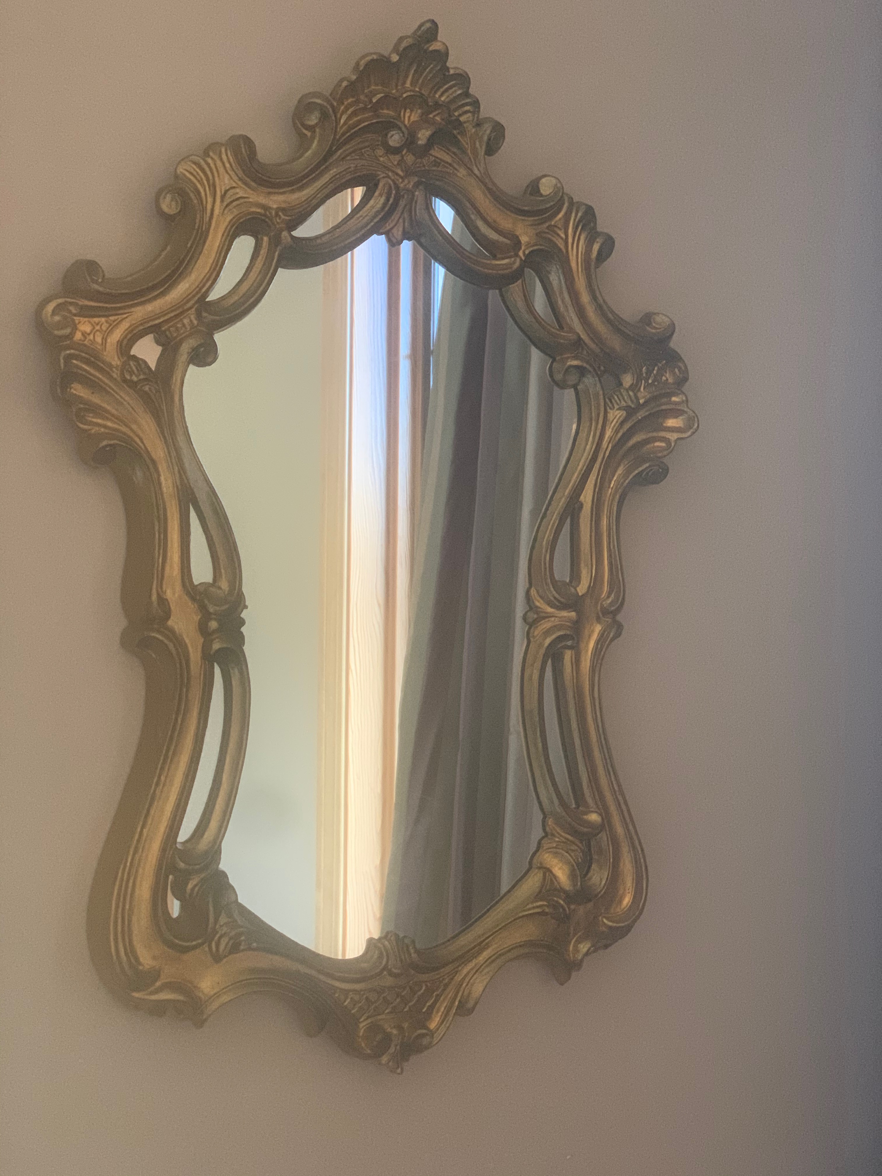 Small gold ornamental wall mirror photo 1